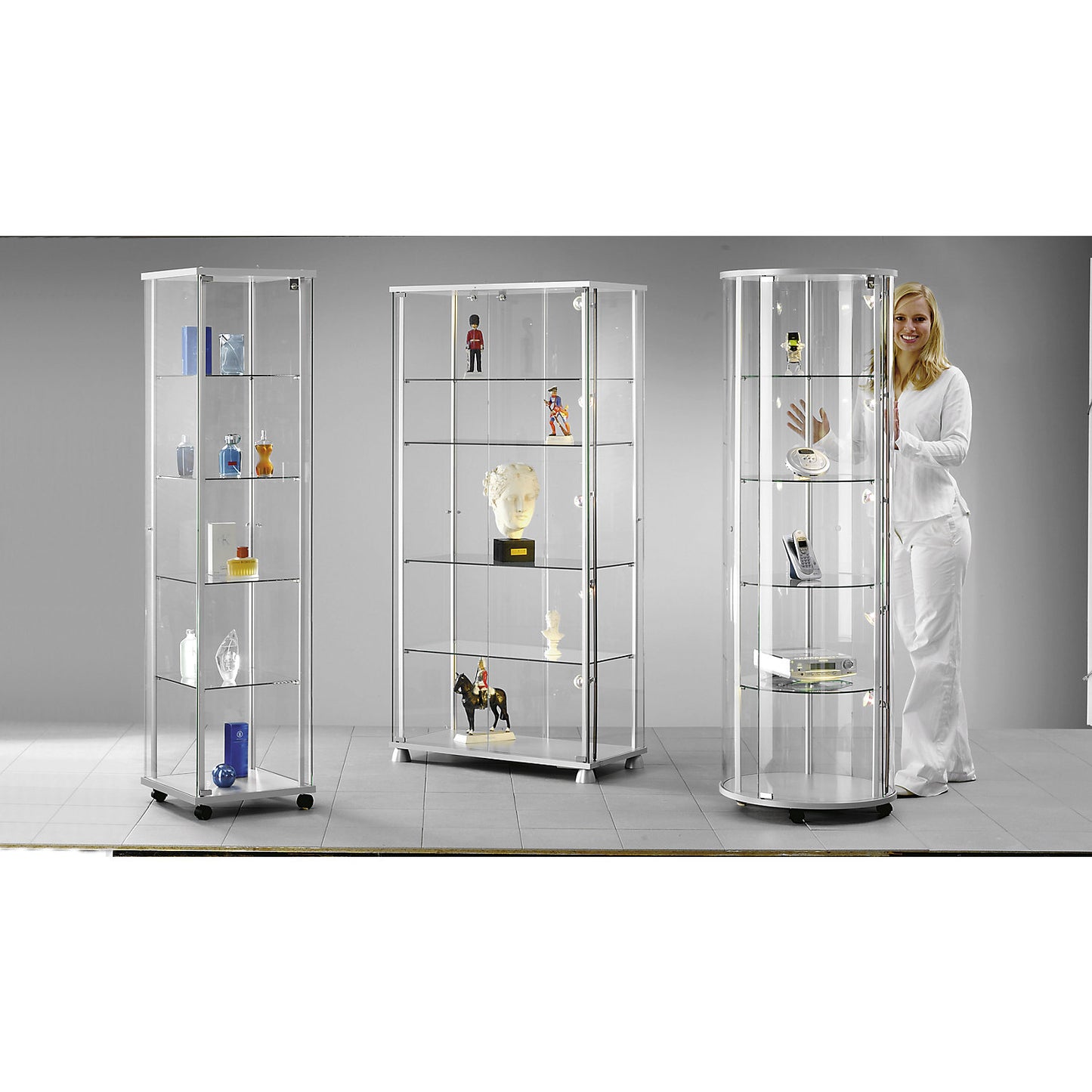 Glass display cabinet, 2 hinged doors, 4 decorative feet, with LED lighting.