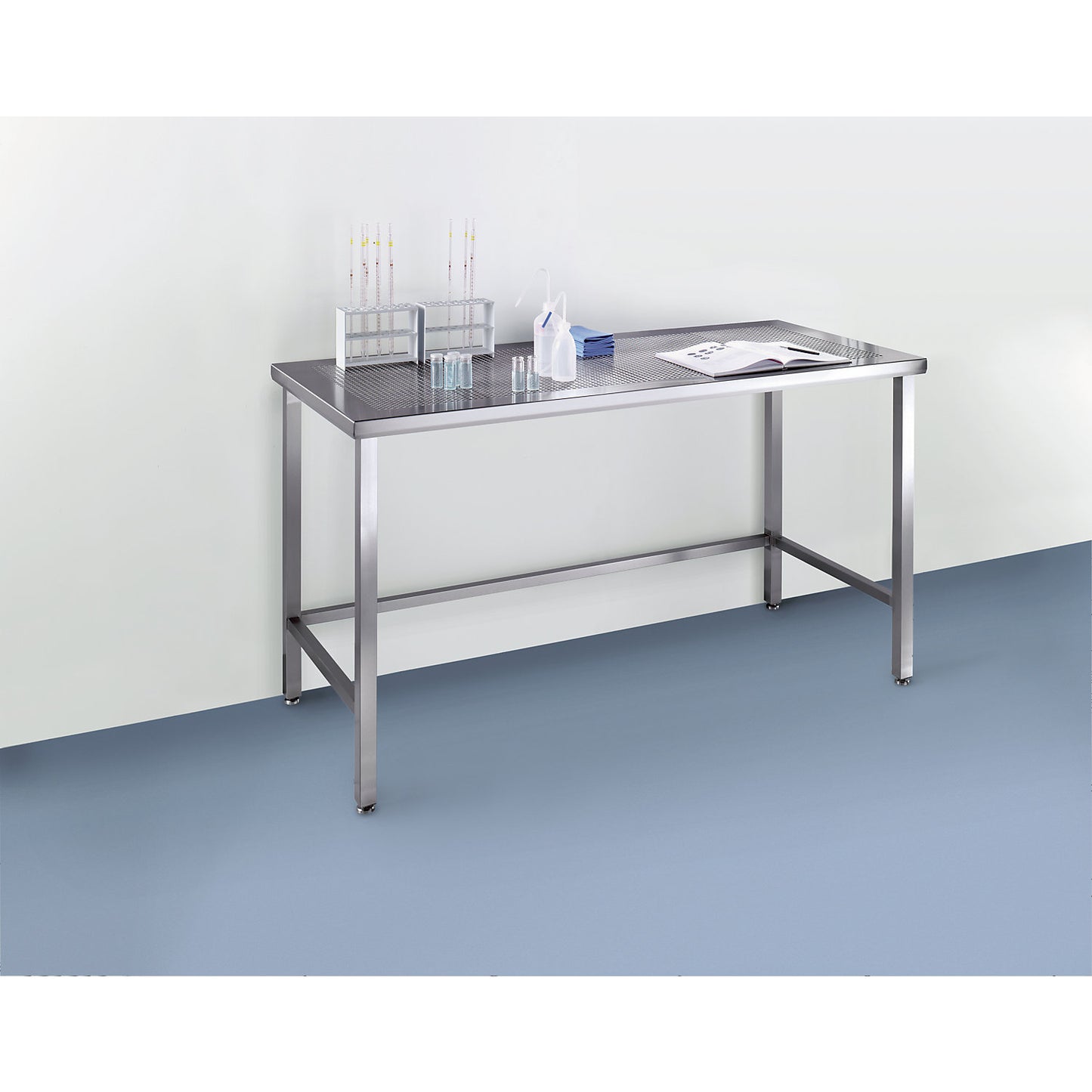 Stainless steel cleanroom table with perforated worktop, made of stainless steel, WxD 1800 x 600 mm.
