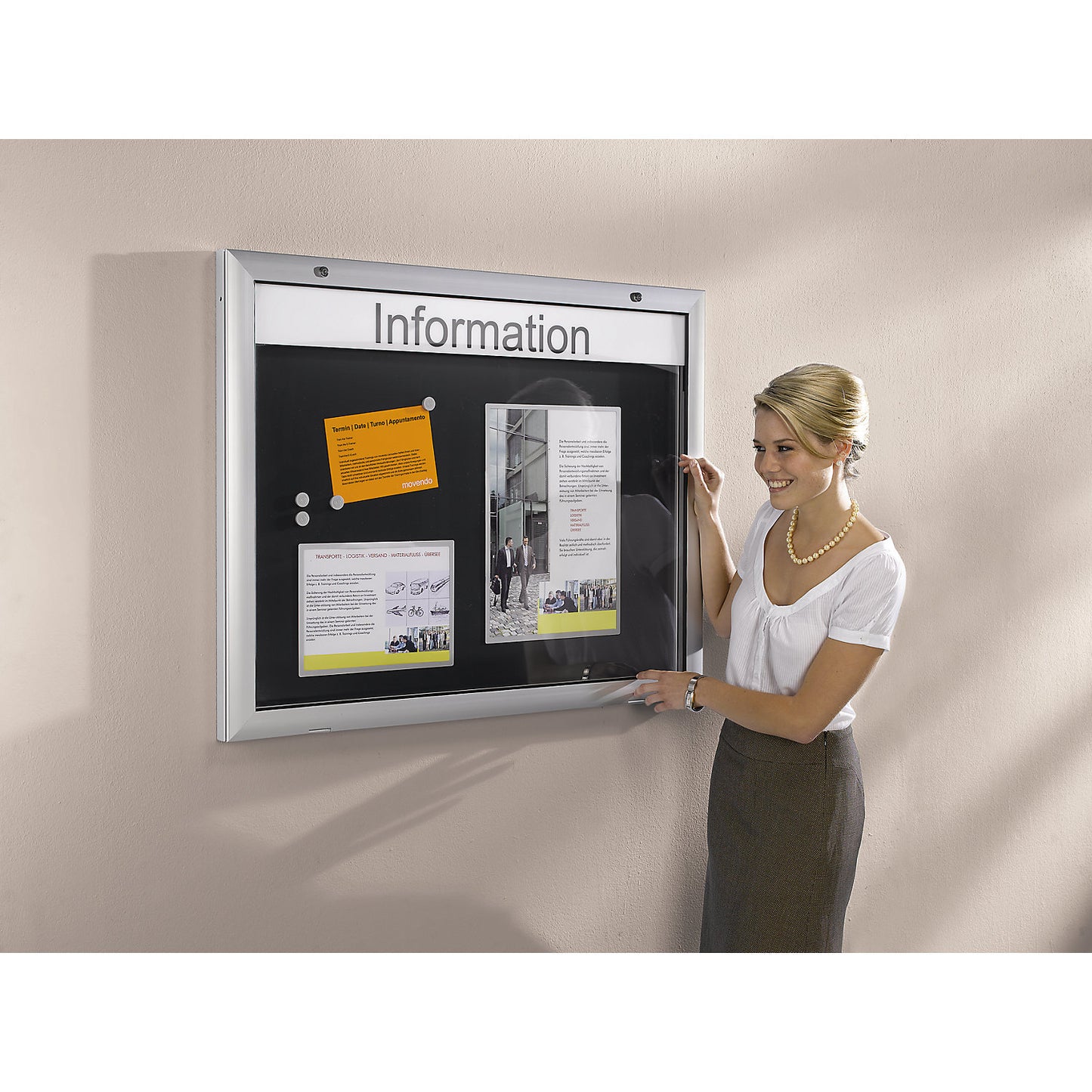 Display case for indoor and outdoor use, door opens downwards 180°, for A0, rear panel pure white RAL 9010.