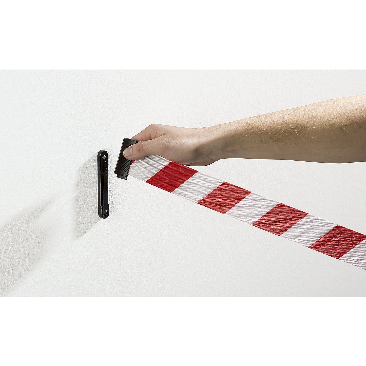 Wall clip, for tape barrier posts, for securing the textile belt.