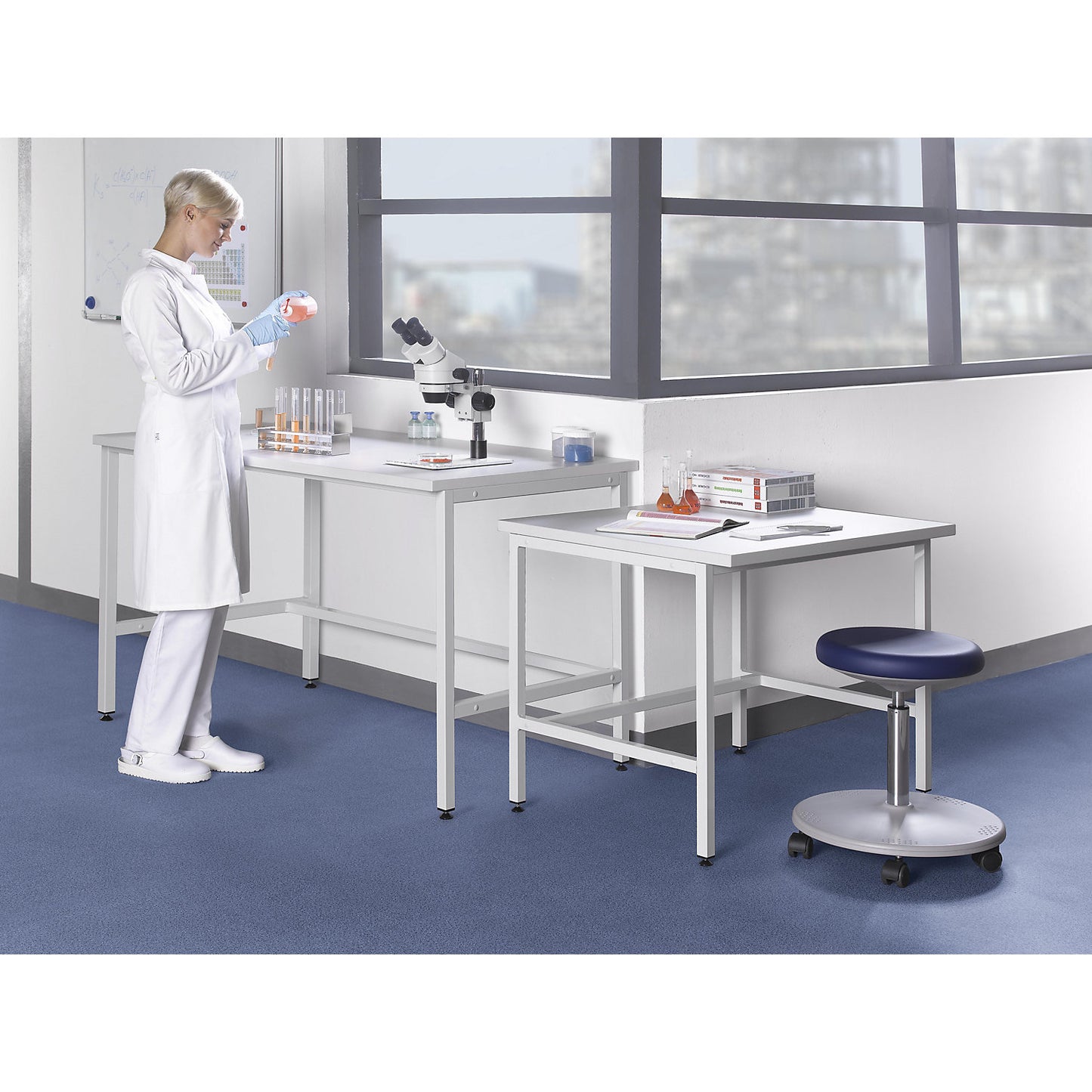 Laboratory table with H-leg frame, sitting working height 750 mm, WxD 600 x 750 mm.