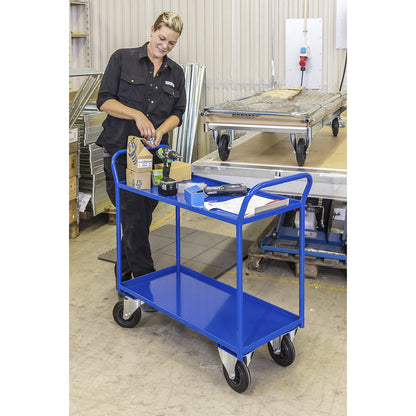 KM41 table trolley, 2 shelves with raised edges, LxWxH 1070 x 550 x 1000 mm, blue, 2 swivel castors with stops, 2 fixed castors.
