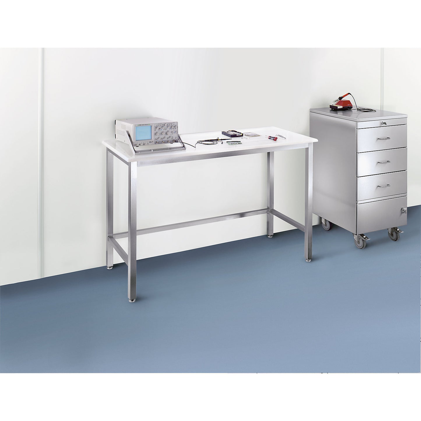 Stainless steel cleanroom table with polypropylene worktop, stainless steel frame, height 900 mm, WxD 1800 x 600 mm.