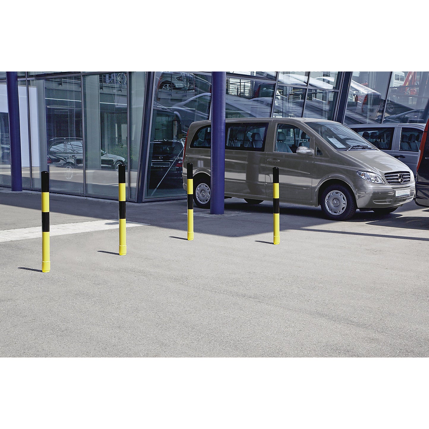 Barrier post made of steel tubing, flexible, Ø 76 mm, for setting in concrete, black / yellow.