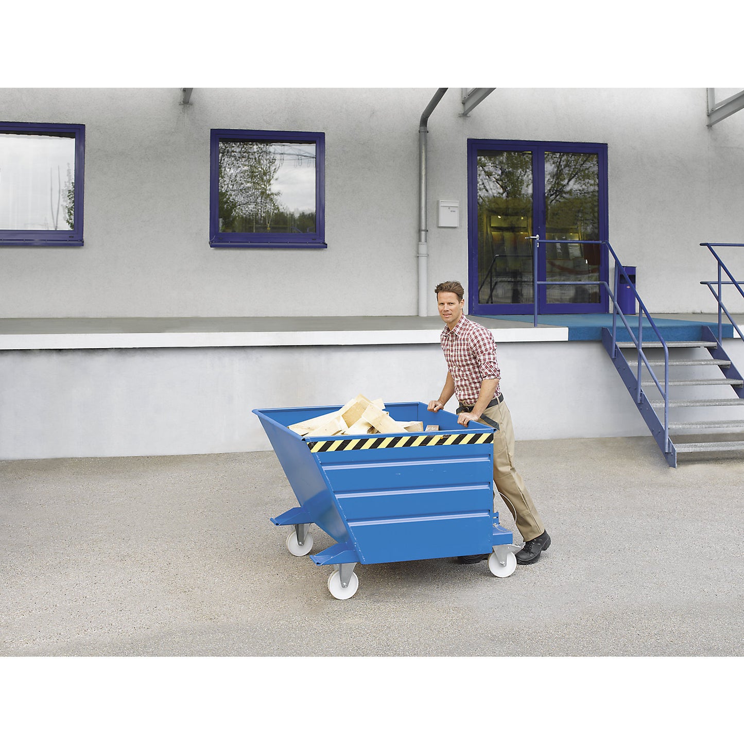 Tilting skip, compact design, capacity 0.55 m³, yellow orange.
