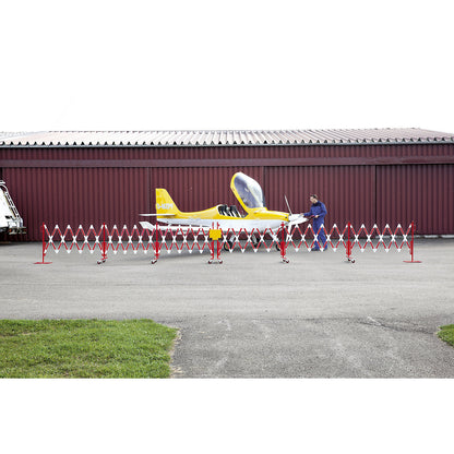Expanding barrier, steel foot and castors, red / white, max. length 16000 mm.