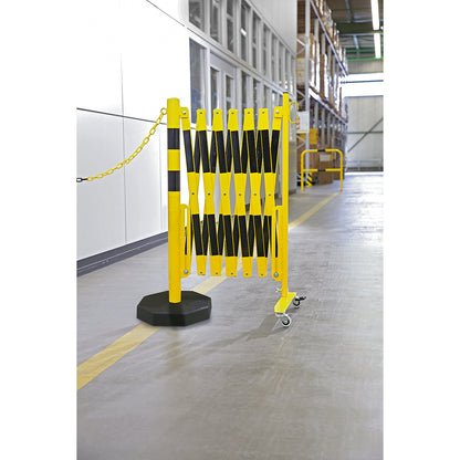 Barrier post with expanding barrier, round tubing Ø 60 mm, with mobile foot plate, yellow / black, max. length 3600 mm.