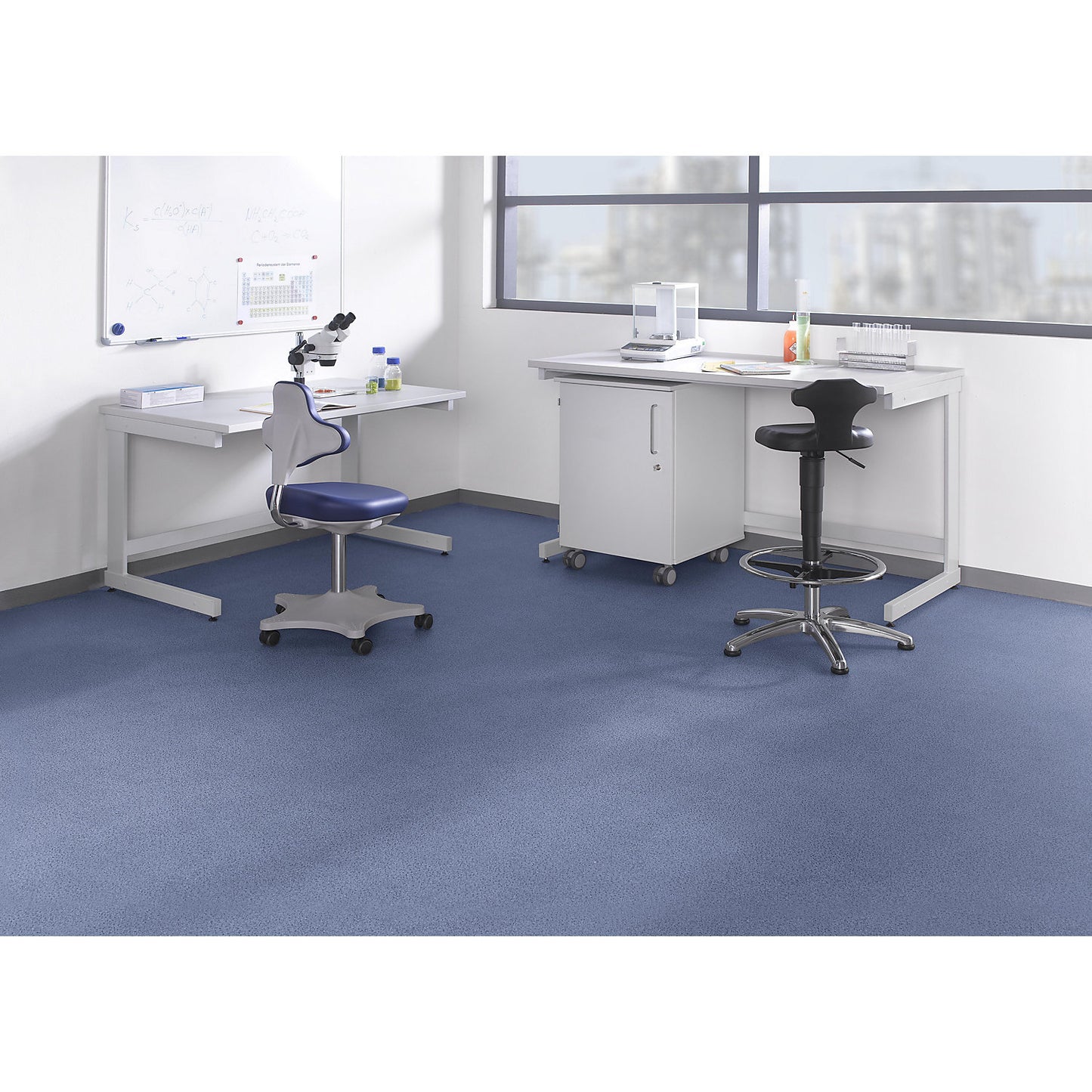 Laboratory table with C-foot frame, standing working height 900 mm, WxD 1500 x 750 mm.