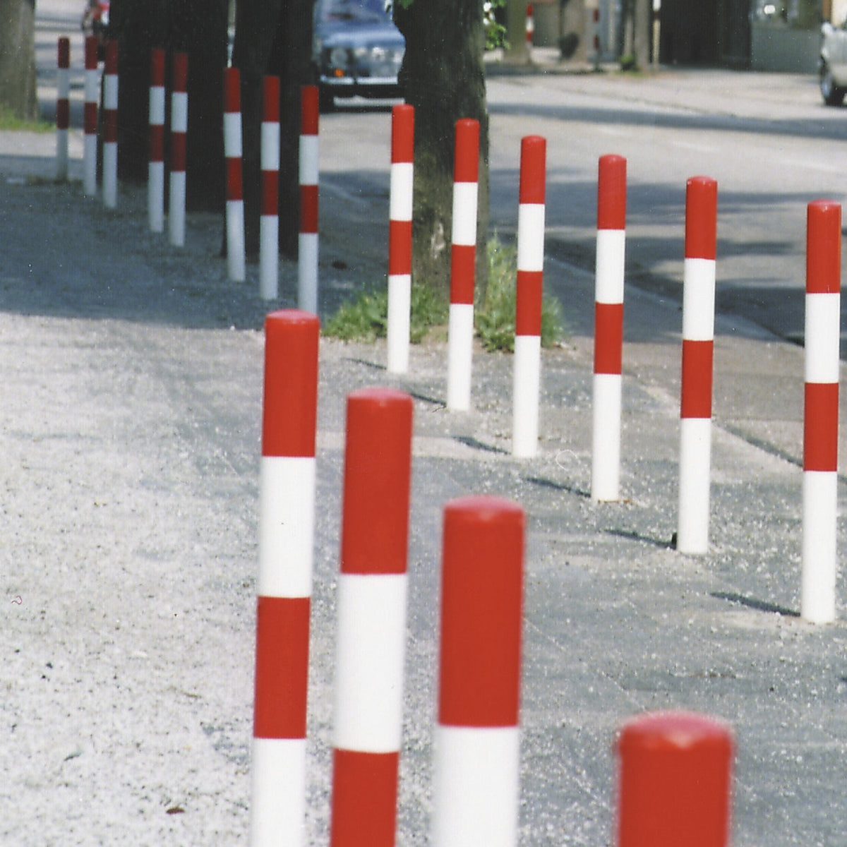 Bollard Morion, for setting in concrete, Ø 76 mm, painted black/yellow, 2 eyelets.