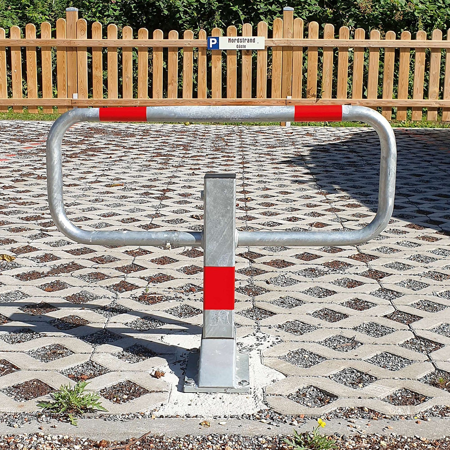 Parking barrier, for bolting in place, hot dip galvanised/reflective red.