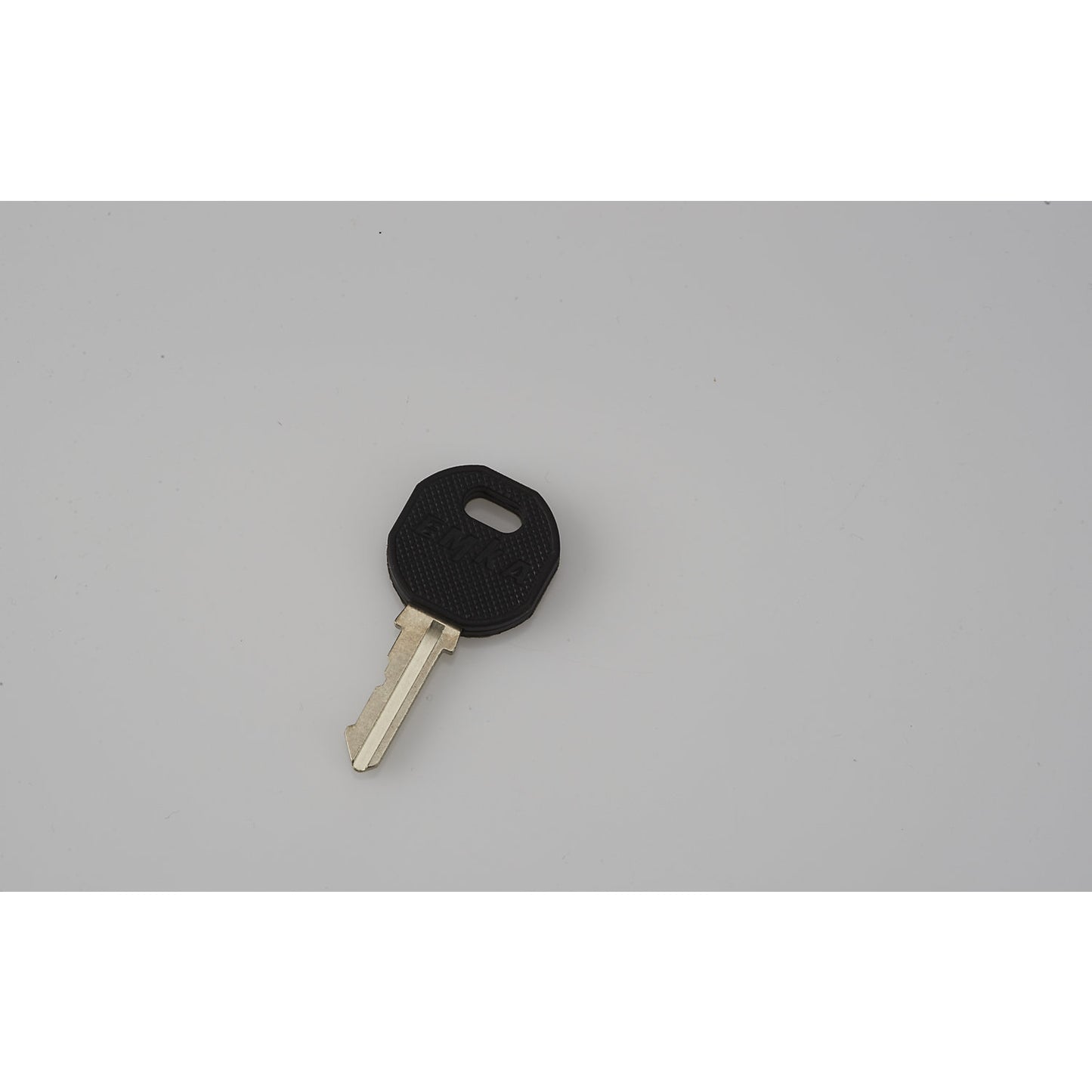 Key, suitable for rotary lever, for a shelf truck.