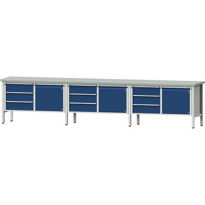 Workbench extra wide, frame construction, 3 doors, 9 drawers are fully extendable, working height 890 mm, sheet steel covered worktop.
