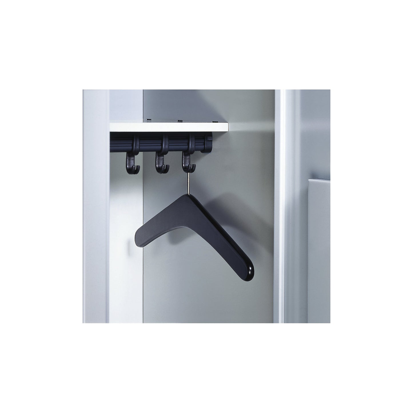 Coat hanger, with special pin mounted suspension made of hardwood, painted black.
