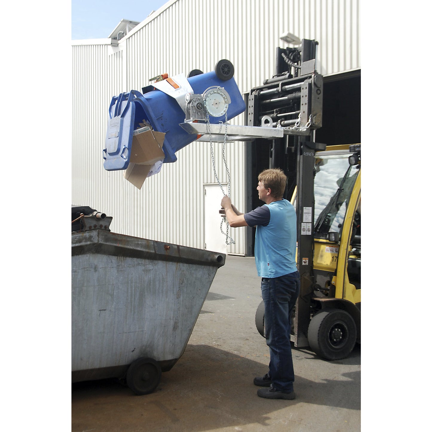 Drum tilting unit, for forklift and crane operation, with chain loop, painted yellow orange.