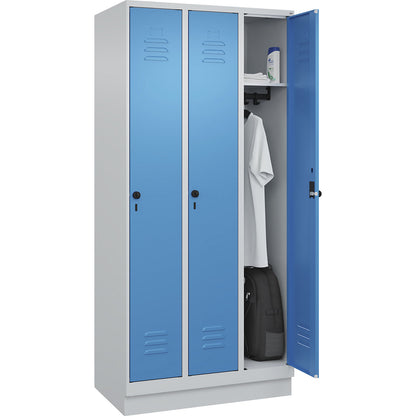 Classic PLUS clothes locker, 3 compartments, light grey/light blue, W 900 mm, with base plinth, rotary bolt.