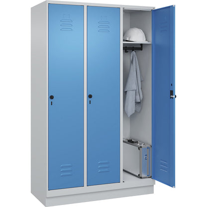 Classic PLUS clothes locker, 3 compartments, light grey/light blue, W 1200 mm, with base plinth, rotary bolt.
