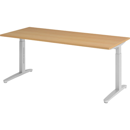 ANNY - Desk with C-foot frame, height adjustable 650 - 850 mm, width 1800 mm, beech / aluminium silver.